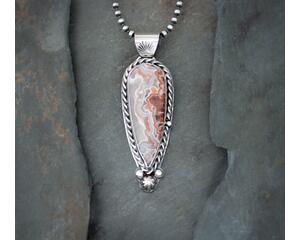 front hanging copper, pink and gray agate gemstone accented with twisted wire and beads on 18 inch 3mm navajo pearls with lobster clasp